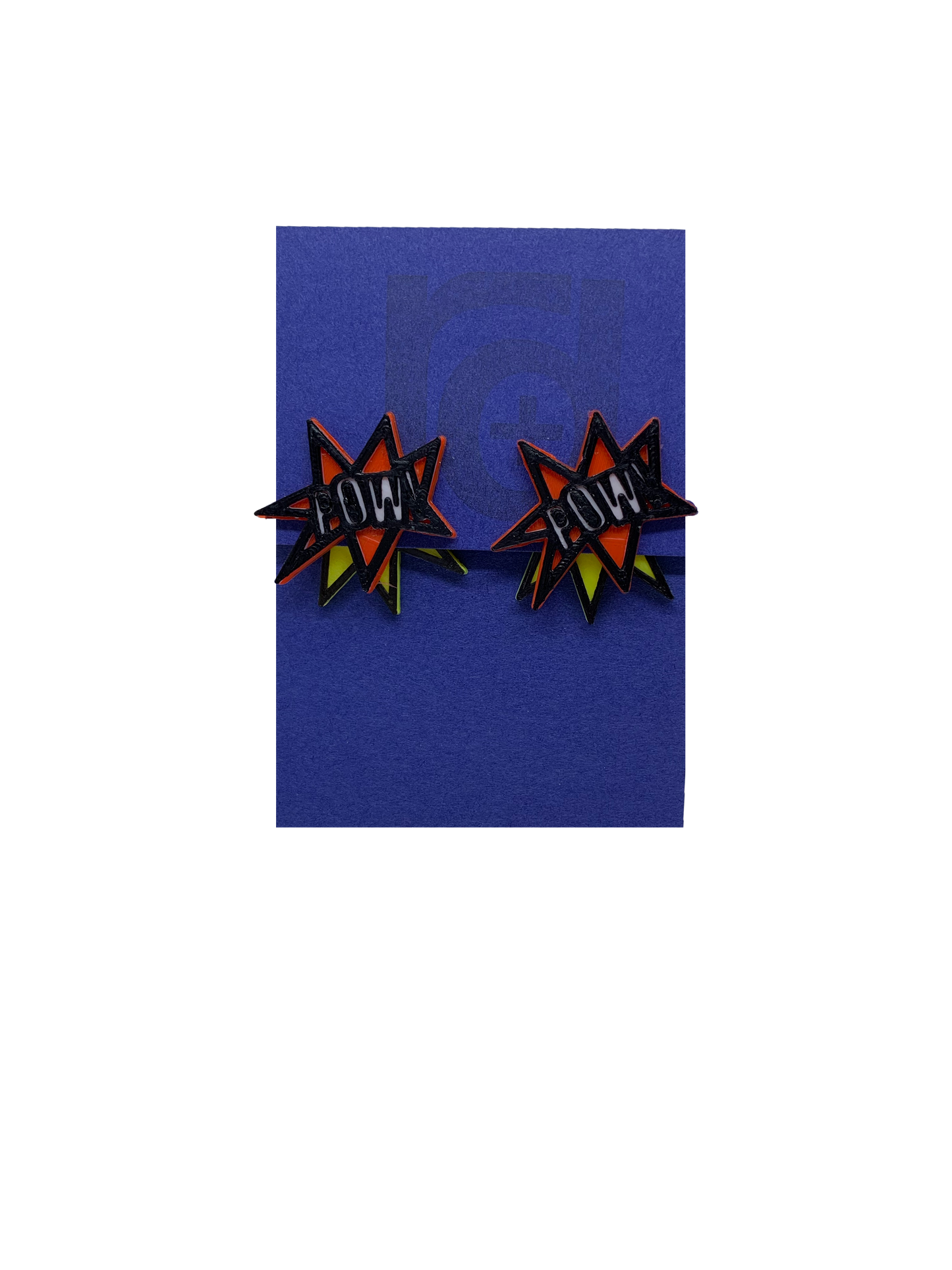 On a bright blue earring tag are two R+D earrings. They are front back earrings or ear jackets where there is a piece that hugs each side of the earlobe. The front shows a ref star burst that reads POW! in white. It is all outlined in black. The piece that fits behind the ear is a yellow starburst with a black outline. They are meant to look like a classic comic book illustration of a sound.
