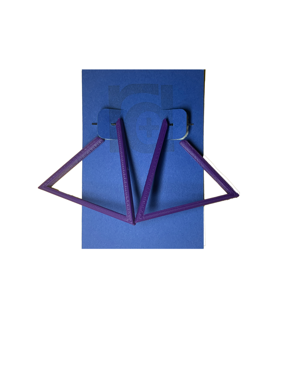 Hanging off of a blue R+D earring card are two 3D printed earrings. They are hoops that are in the shape of a triangle. These earrings are printed in a eco friendly purple. 