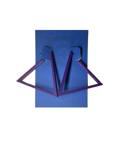 Hanging off of a blue R+D earring card are two 3D printed earrings. They are hoops that are in the shape of a triangle. These earrings are printed in a eco friendly purple. 