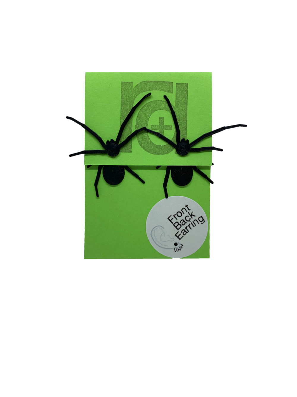 Two front back or jacket earrings are pictured on a bright green paper earring card. Each earring has two parts that are worn on each side of the earlobe. The effect is that these black long legged spiders will look as though they are crawling through your earlobe when you wear them. The front piece has two legs and the spider's head with little pinchers visible. The back piece has two more legs and a rounded black body. 