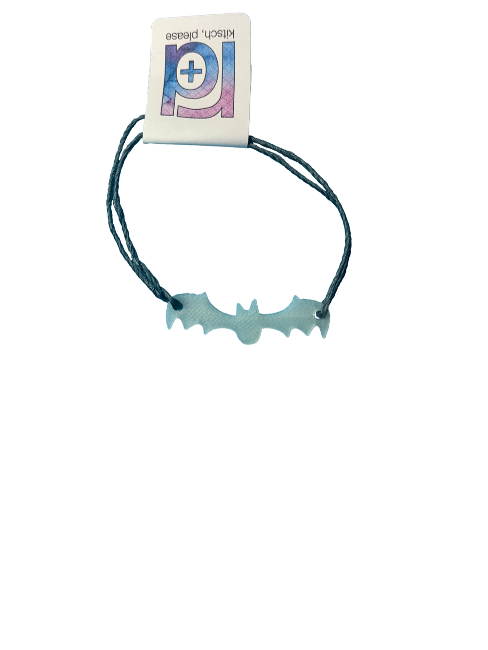 Pictured on a transparent background is a bracelet. There are two dark grey strands and they are holding on to a 3D printed bat that glows in the dark. Hidden by a R+D tag are the two adjustable knots.