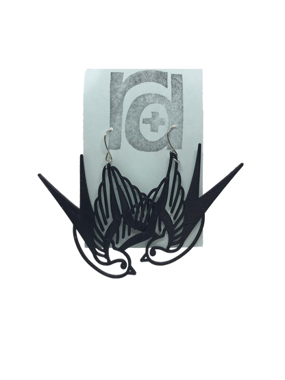 On a light blue earring card are two R+D earrings. They are black and look like two swallow birds that are circling or flying down.