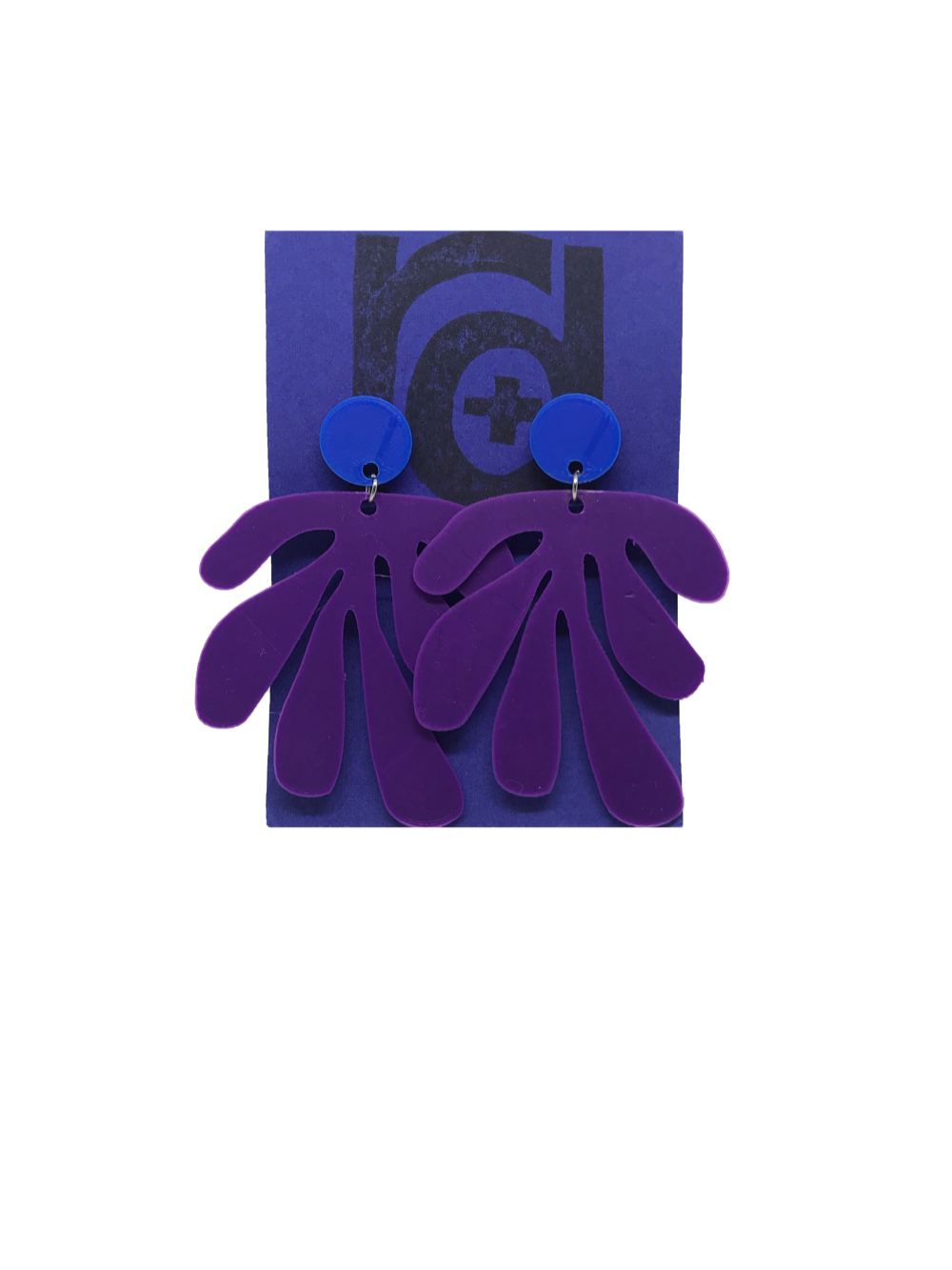 Shown on a bright blue R+D earring card, these earrings have a circlar piece at the top linked to an abstract shape based on Matisse's cut out work. This set is shown in Blue and purple plant based filament. 