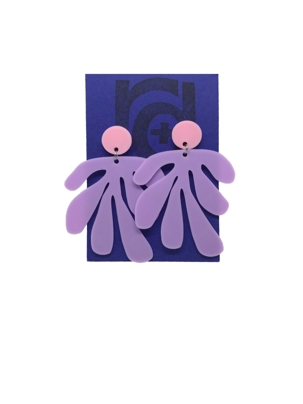 Shown on a bright blue R+D earring card, these earrings have a circlar piece at the top linked to an abstract shape based on Matisse's cut out work. This set is shown in light pink and light purple plant based filament. 